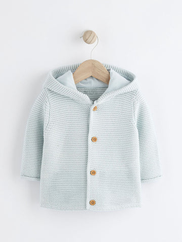 Knitted baby cardigan with buttons on a white background