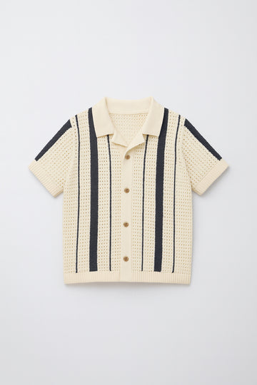 Beige short-sleeve shirt with black stripes on a light gray background