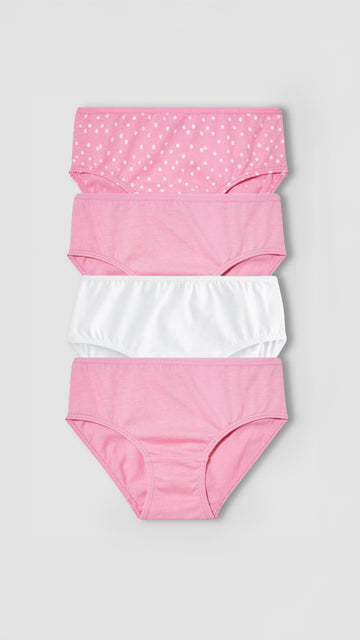 Set of four pairs of girl's underwear with different patterns on a light gray background
