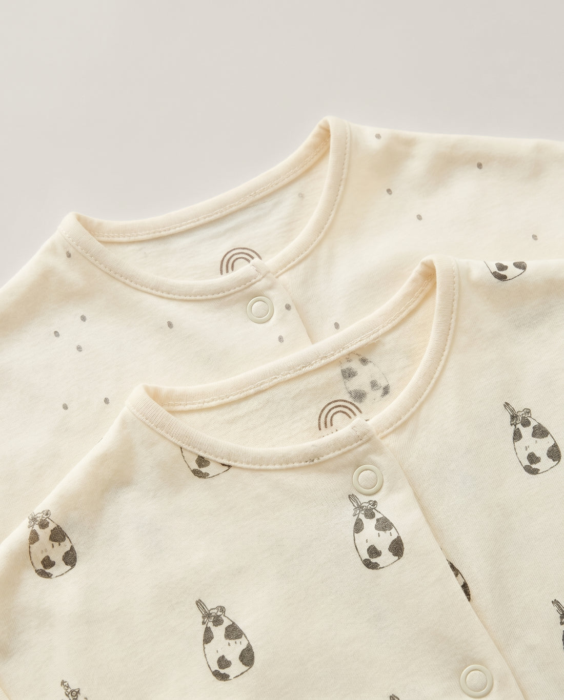 2-Pack Baby Rompers – Cream Speckle & Milk Bottle Print