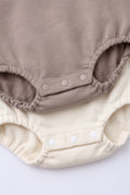 PTex Fashion baby bodysuits close-up showing three-snap crotch closure and elasticated leg openings in mocha and cream