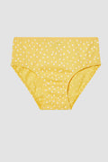 Yellow polka dot girl's underwear on a light gray background