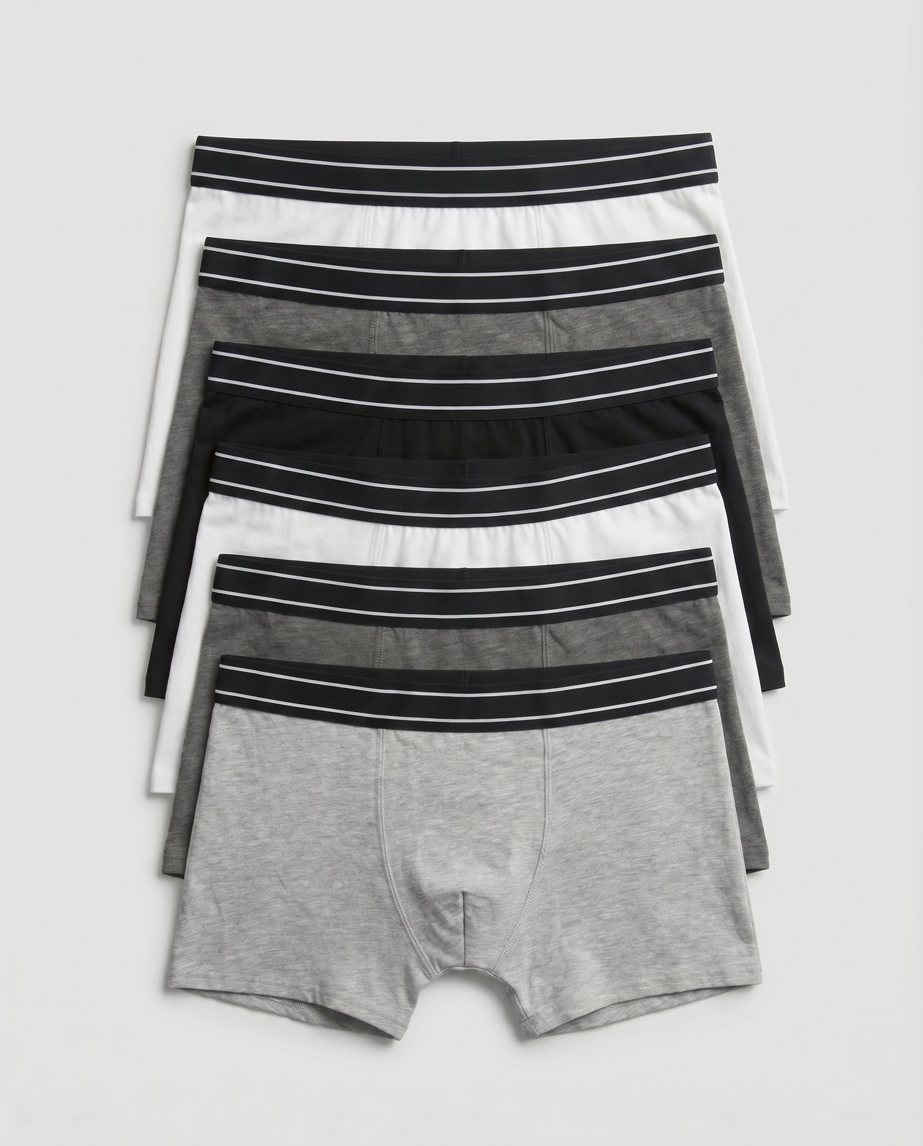 Boys' soft cotton boxer briefs 7-piece pack laid out in black, grey and white