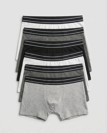 Boys' soft cotton boxer briefs 7-piece pack laid out in black, grey and white