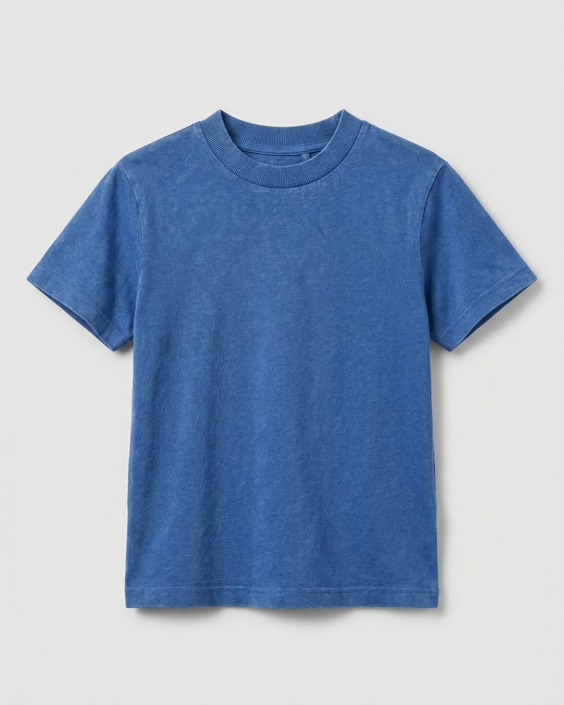 Flat lay of a boy's blue acid wash crew neck T-shirt with short sleeves and a relaxed fit, displayed on a light grey background.