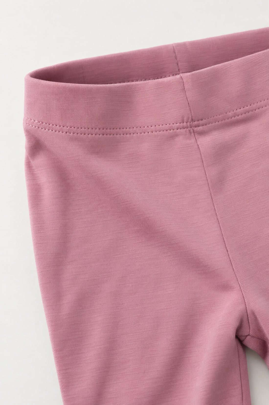 Dusty muted pink toddler girls leggings with elasticated waistband and fitted full-length design on a clean white background.