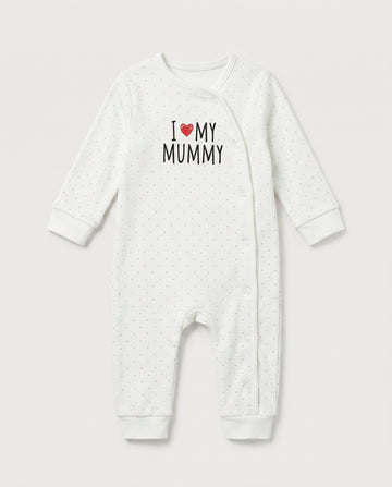 Ivory baby long-sleeve romper with grey polka dot print and "I Love My Mummy" chest graphic with red heart, featuring side snap button closure and ribbed cuffs at wrists and ankles