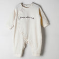 Baby Romper in beige color with a waffle fabric pattern