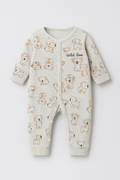 Baby romper with animal print on a light gray background