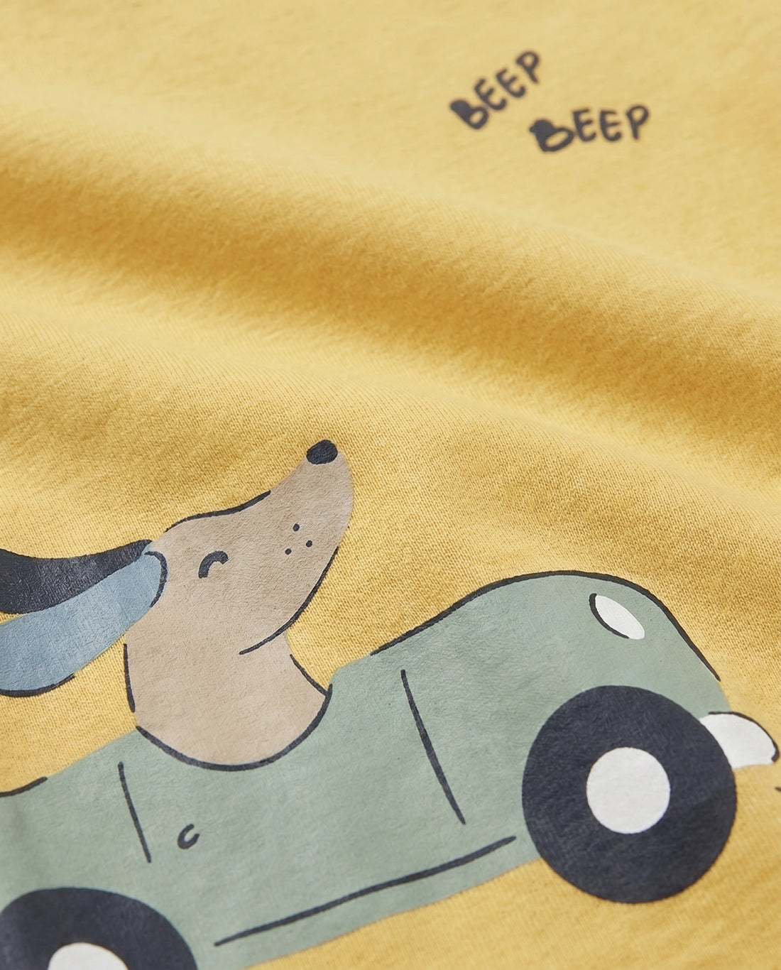 Boys' yellow short-sleeve t-shirt with a puppy driving a green car and Beep Beep slogan print