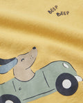 Boys' yellow short-sleeve t-shirt with a puppy driving a green car and Beep Beep slogan print close