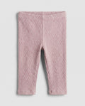 Baby girls' blush pink cable-knit leggings with textured ribbed pattern, flat lay