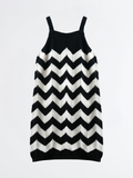 Black and white striped dress on a light gray background