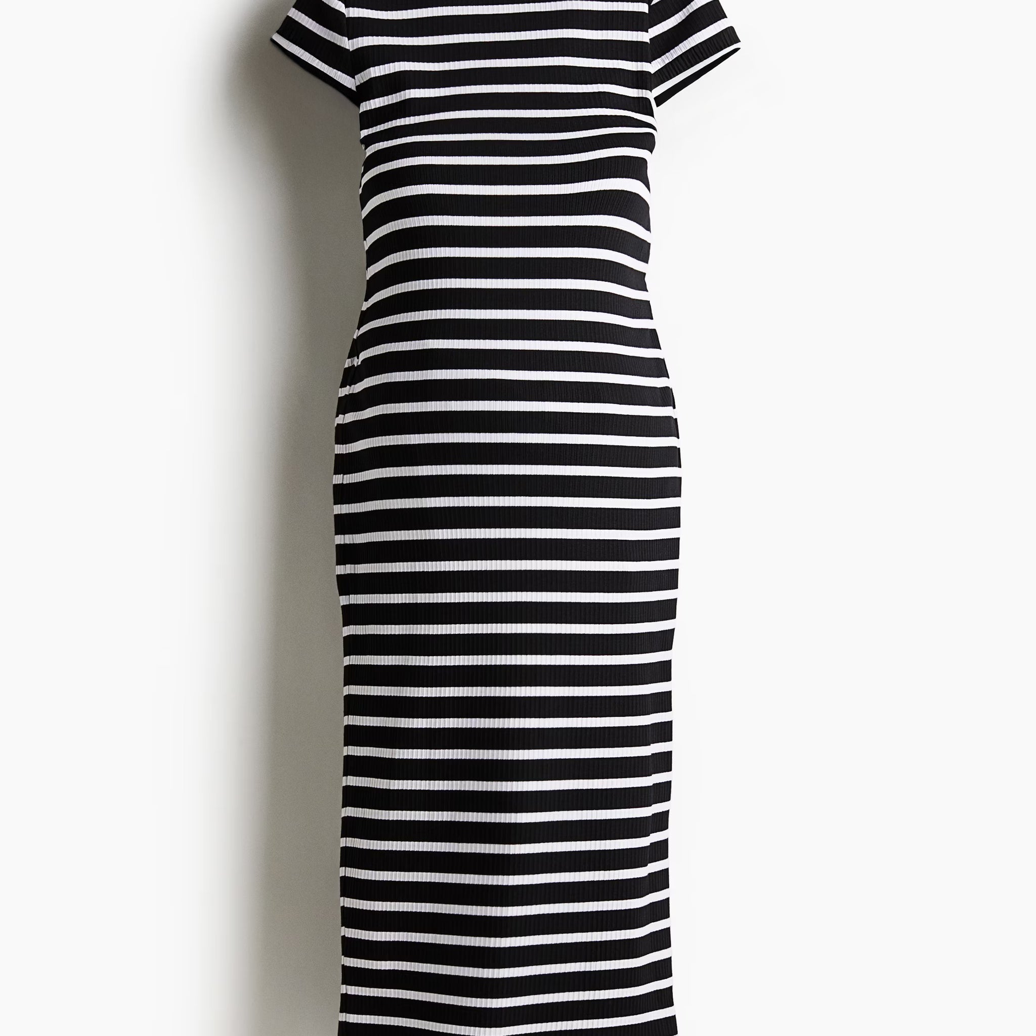 Black and white striped midi dress on a white background