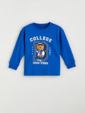 Blue long-sleeve shirt with bear graphic and text on a light grey background