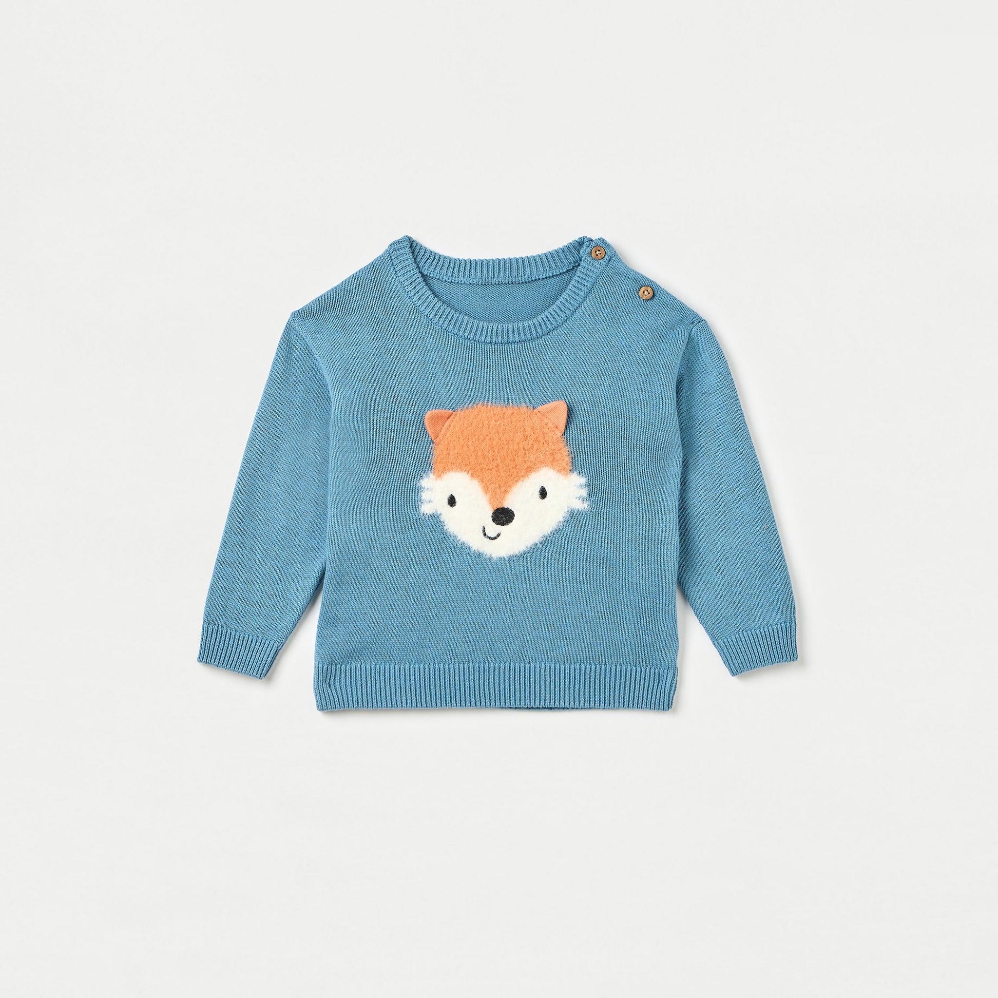 Blue sweater with fox face design on a light gray background