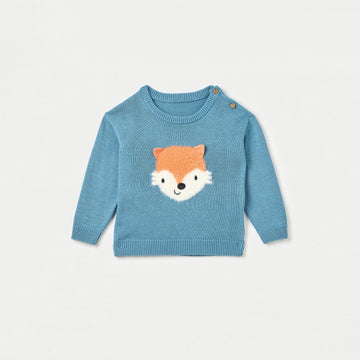 Blue sweater with fox face design on a light gray background