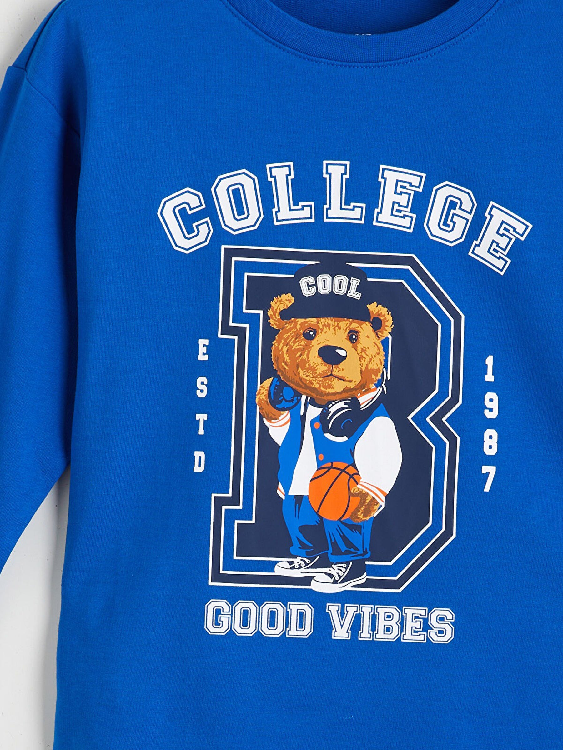 Blue sweatshirt with a bear graphic and text on a white background