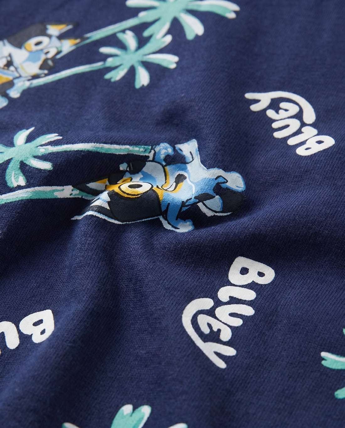 Boys' navy short-sleeve t-shirt with all-over Bluey tropical palm tree print