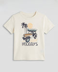  Boys' off white half sleeve cotton t-shirt with surf and holidays adventure graphic, flat lay product photo on light grey background.