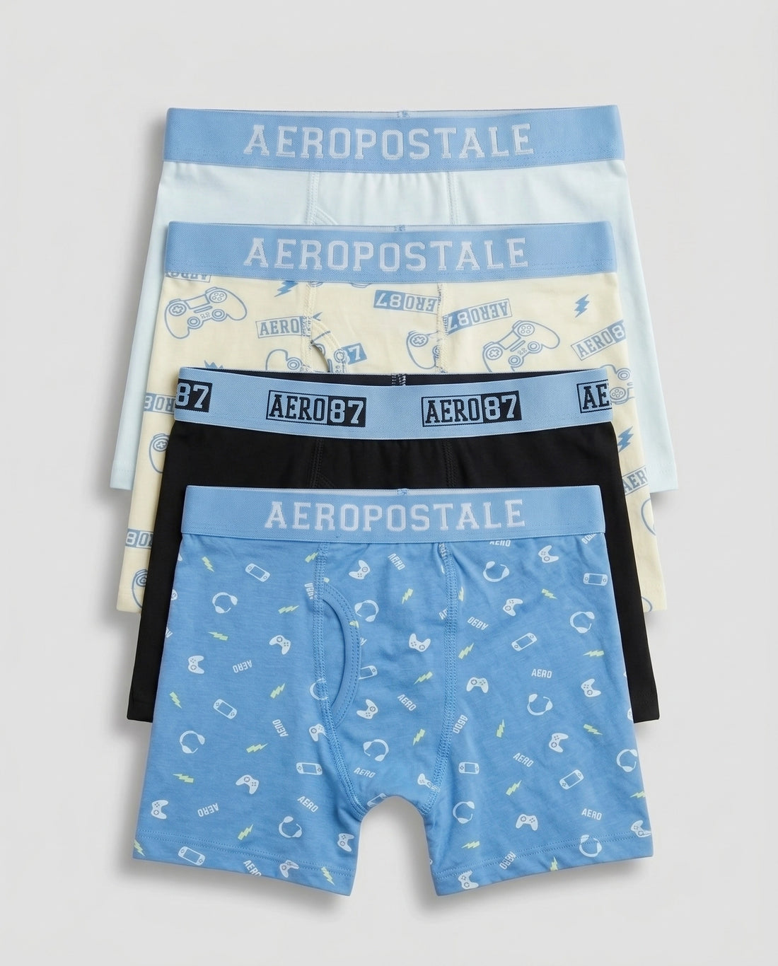 Pack of 4 boys' premium cotton boxer briefs in sky blue gamer print, lime cream controller print, solid black, and powder mint, fanned out flat lay