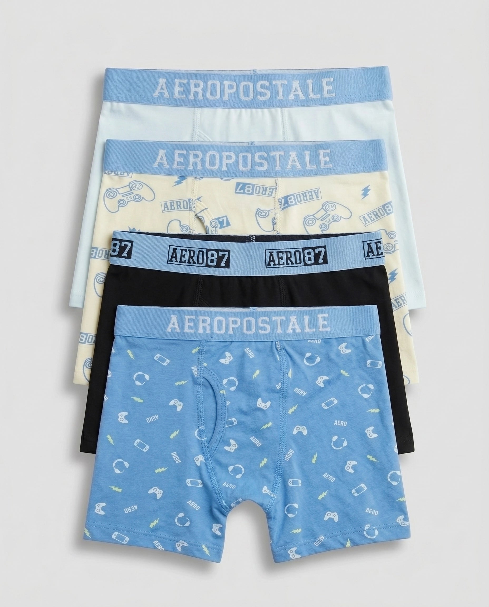 Pack of 4 boys' premium cotton boxer briefs in sky blue gamer print, lime cream controller print, solid black, and powder mint, fanned out flat lay