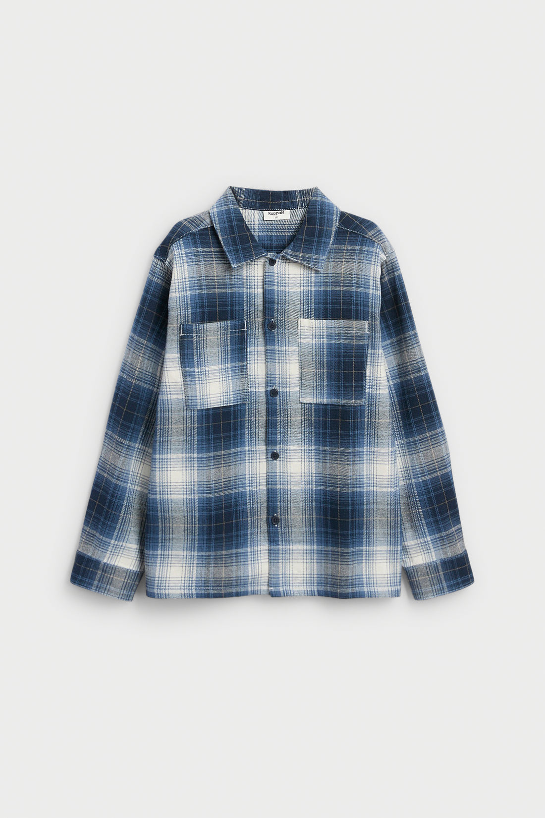 PTex Fashion boys' blue and off-white flannel check overshirt close-up showing brushed twill texture, contrast-stitched patch pocket and navy button