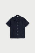 Boys navy linen blend half sleeve shirt with open collar, short sleeves and button-front design.