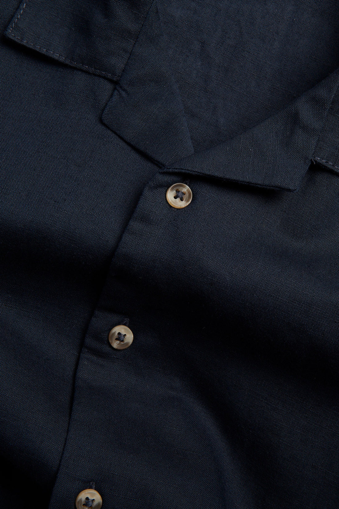 Boys navy linen blend half sleeve shirt with open collar, short sleeves and button-front design.