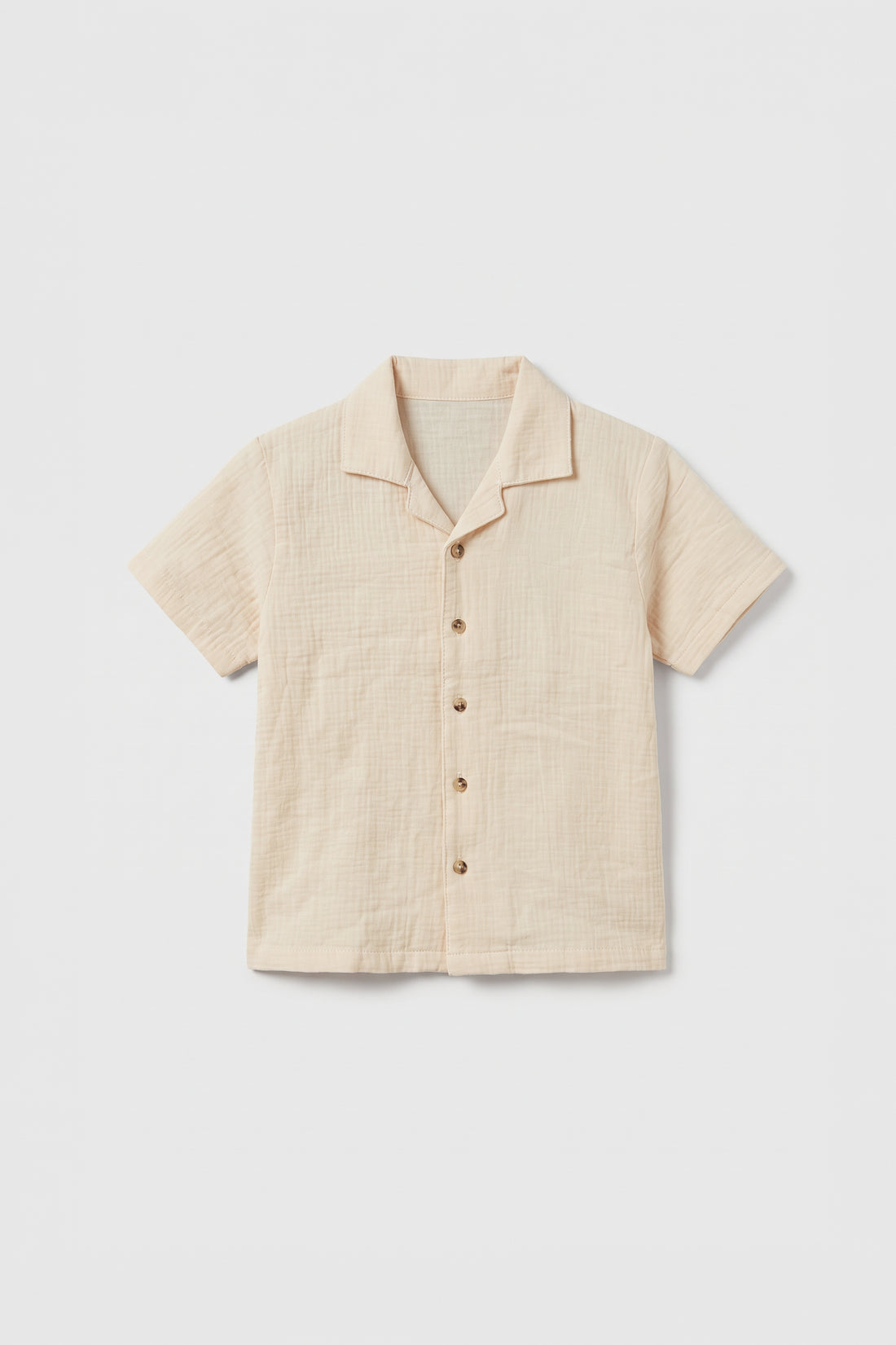 Boys beige muslin cotton short sleeve shirt with camp collar and brown buttons
