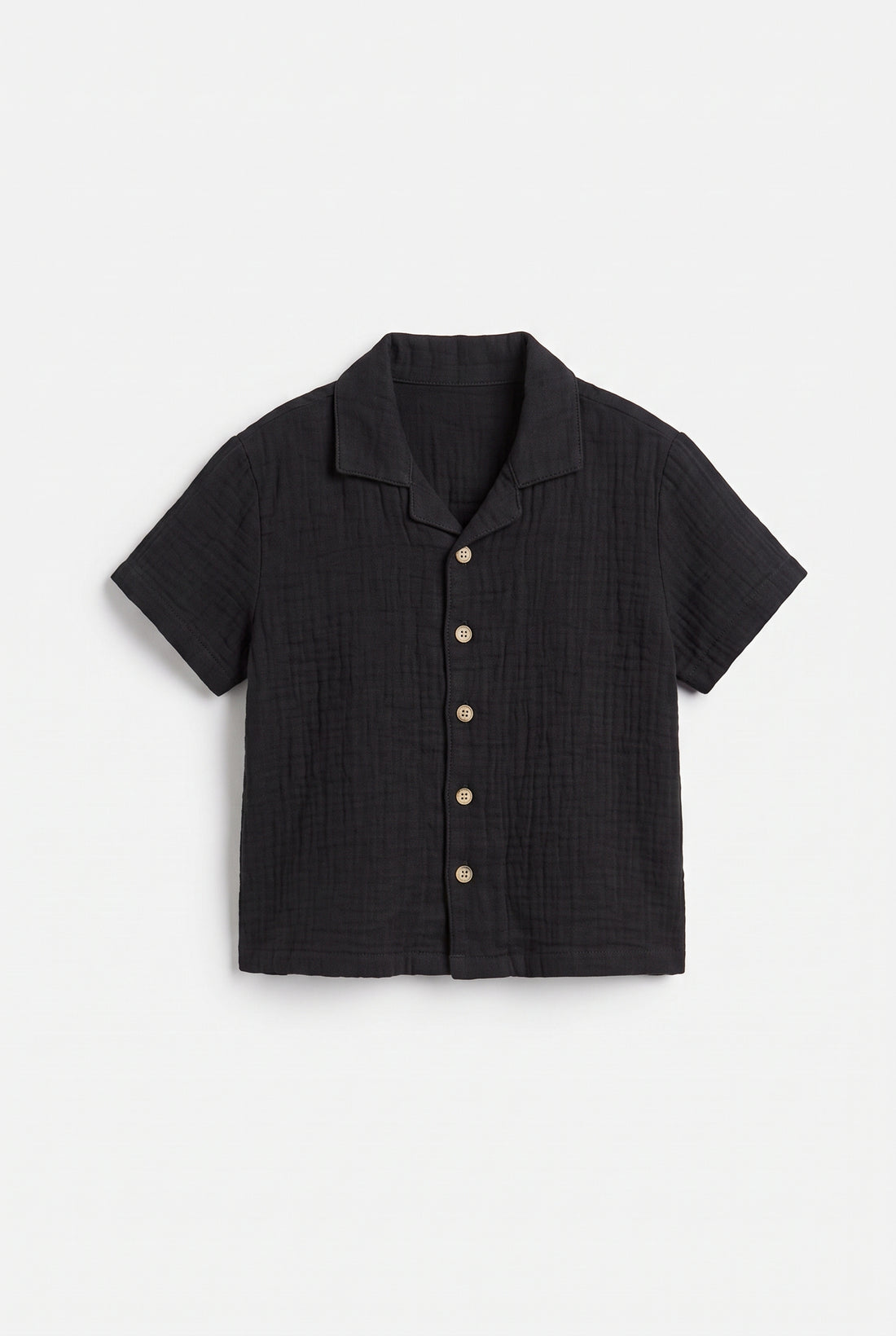 Boys black muslin short sleeve shirt with textured fabric, camp collar and button front