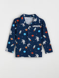 Children's shirt with space-themed print on a white background