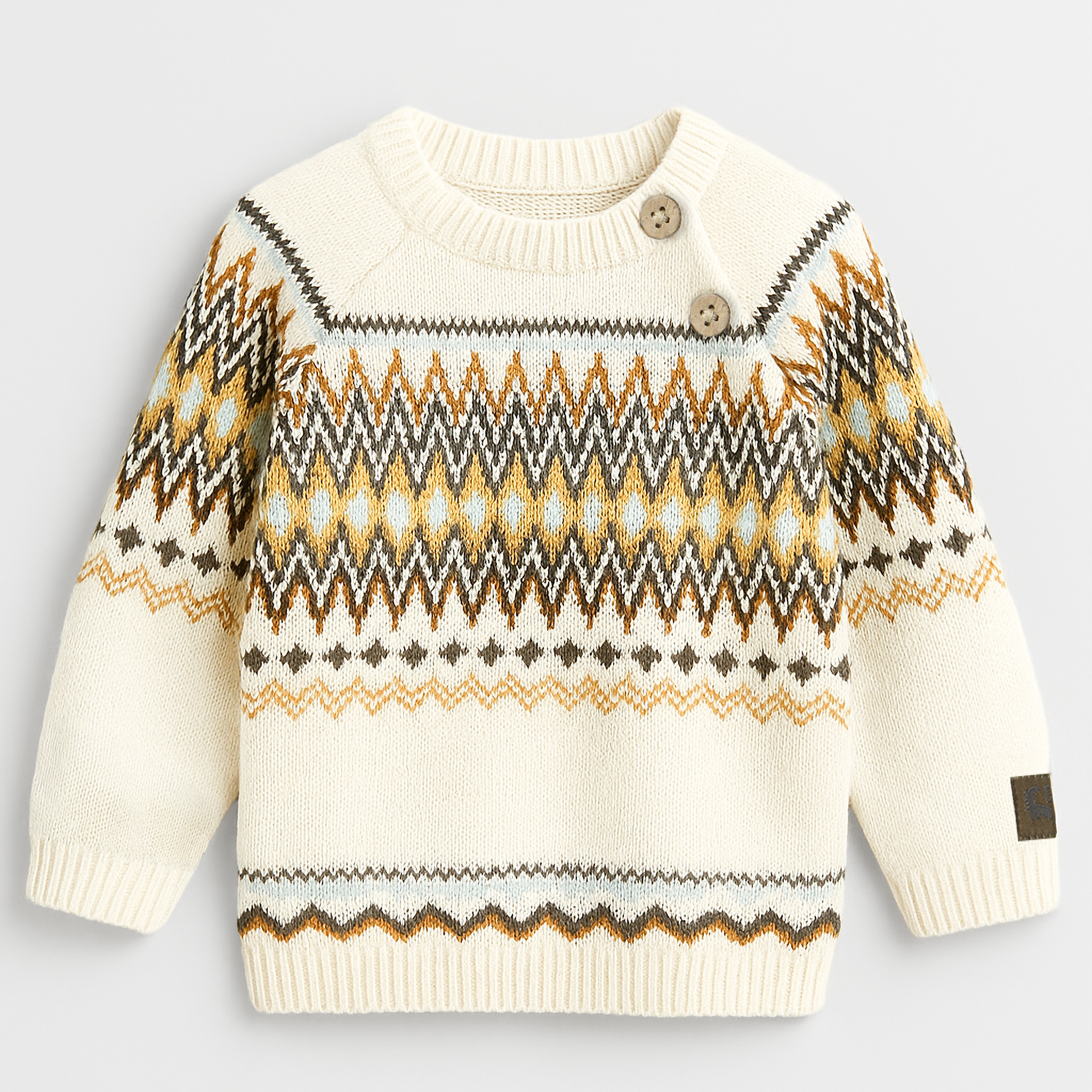 Children's sweater with a pattern on a light gray background