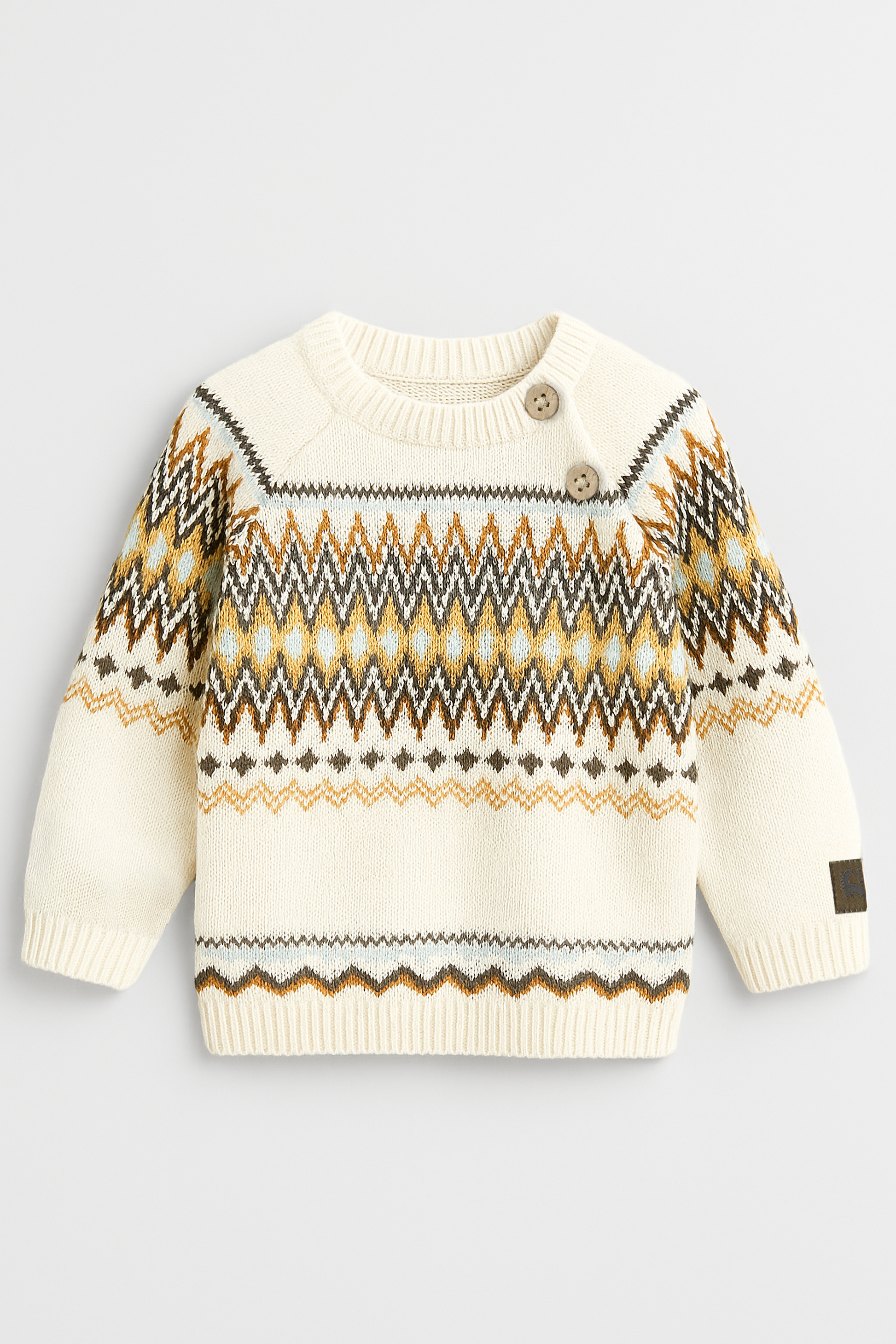 Children's sweater with a pattern on a light gray background