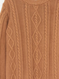Close-up of a caramel colour cable knit sweater