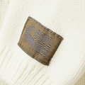 Close-up of a label on a beige fabric background