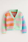 Colorful crocheted cardigan on a light gray background