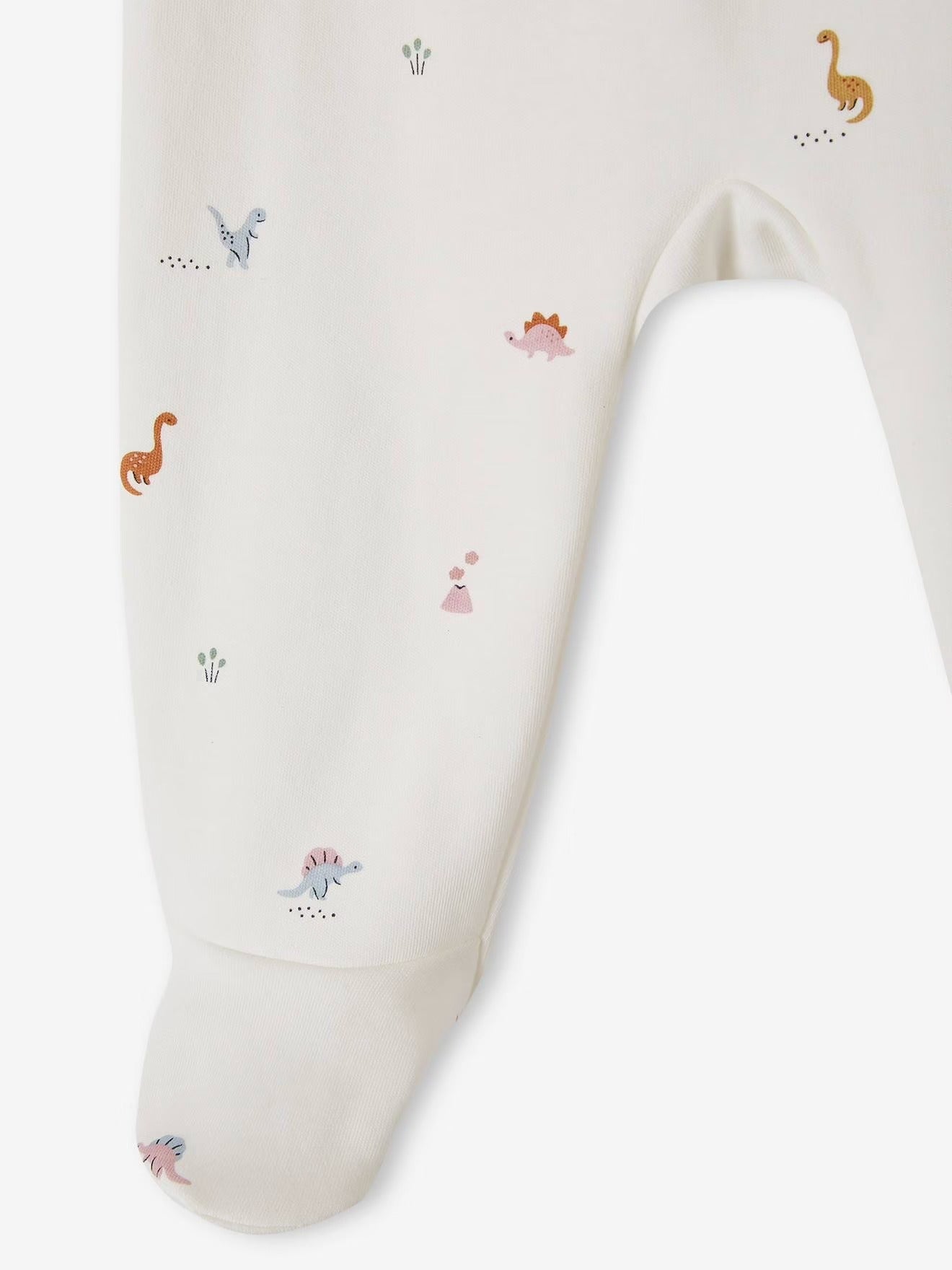 White baby blanket with small animal prints on a white background