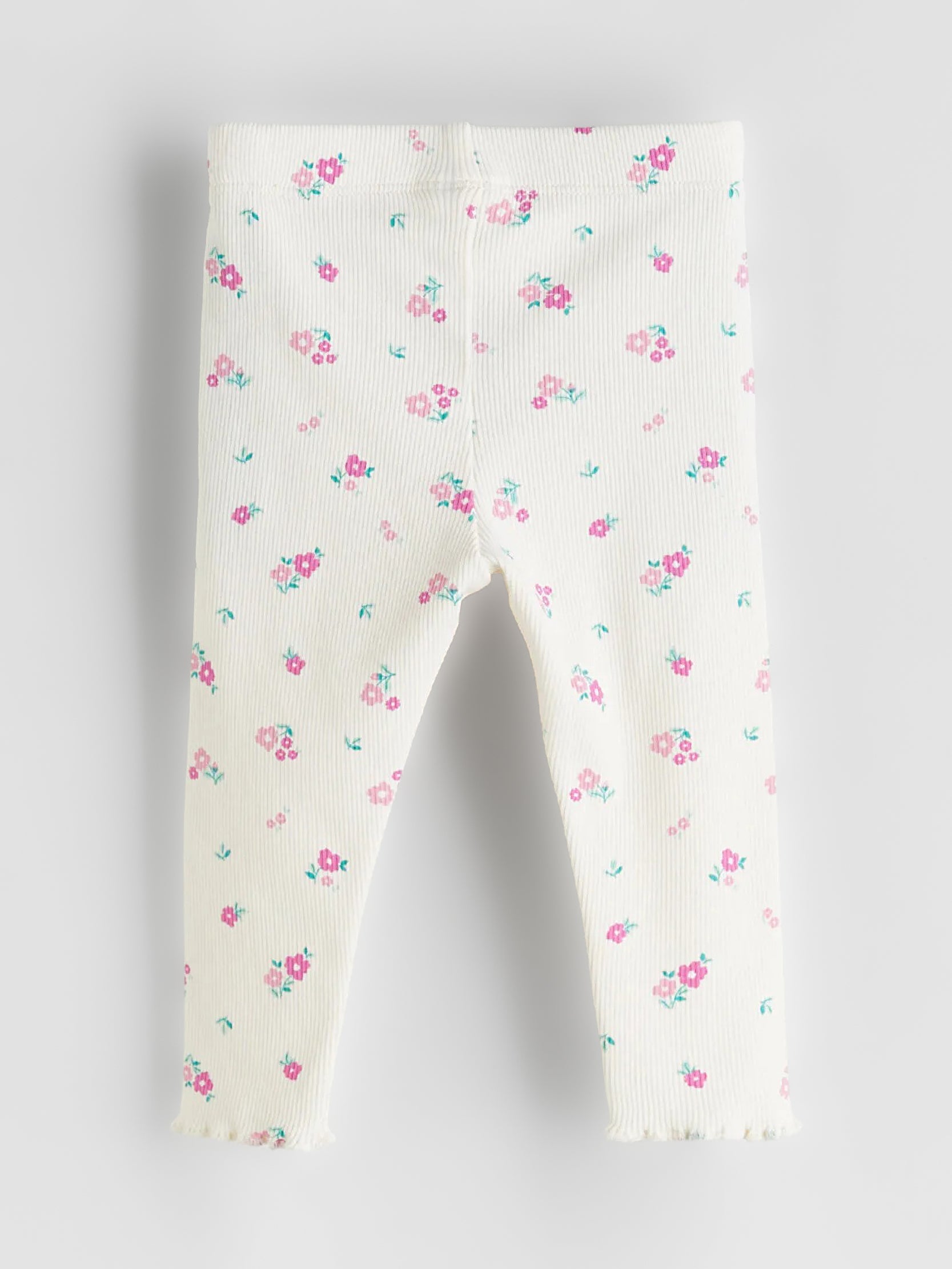 Floral-patterned leggings on a light gray background