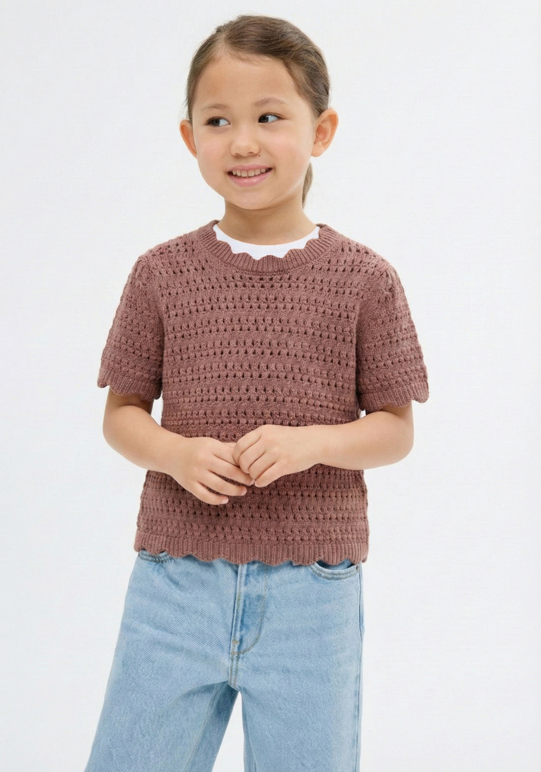 Brown crochet top on a white background