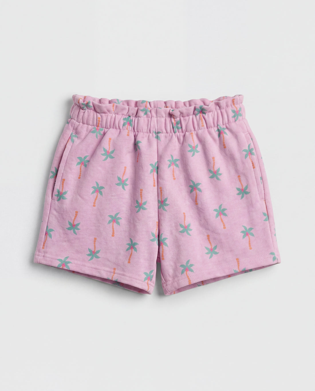 Front flat-lay view of girl's lilac short pant with all-over teal and orange mini palm tree print and ruched paperbag elasticated waistband