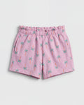 Front flat-lay view of girl's lilac short pant with all-over teal and orange mini palm tree print and ruched paperbag elasticated waistband