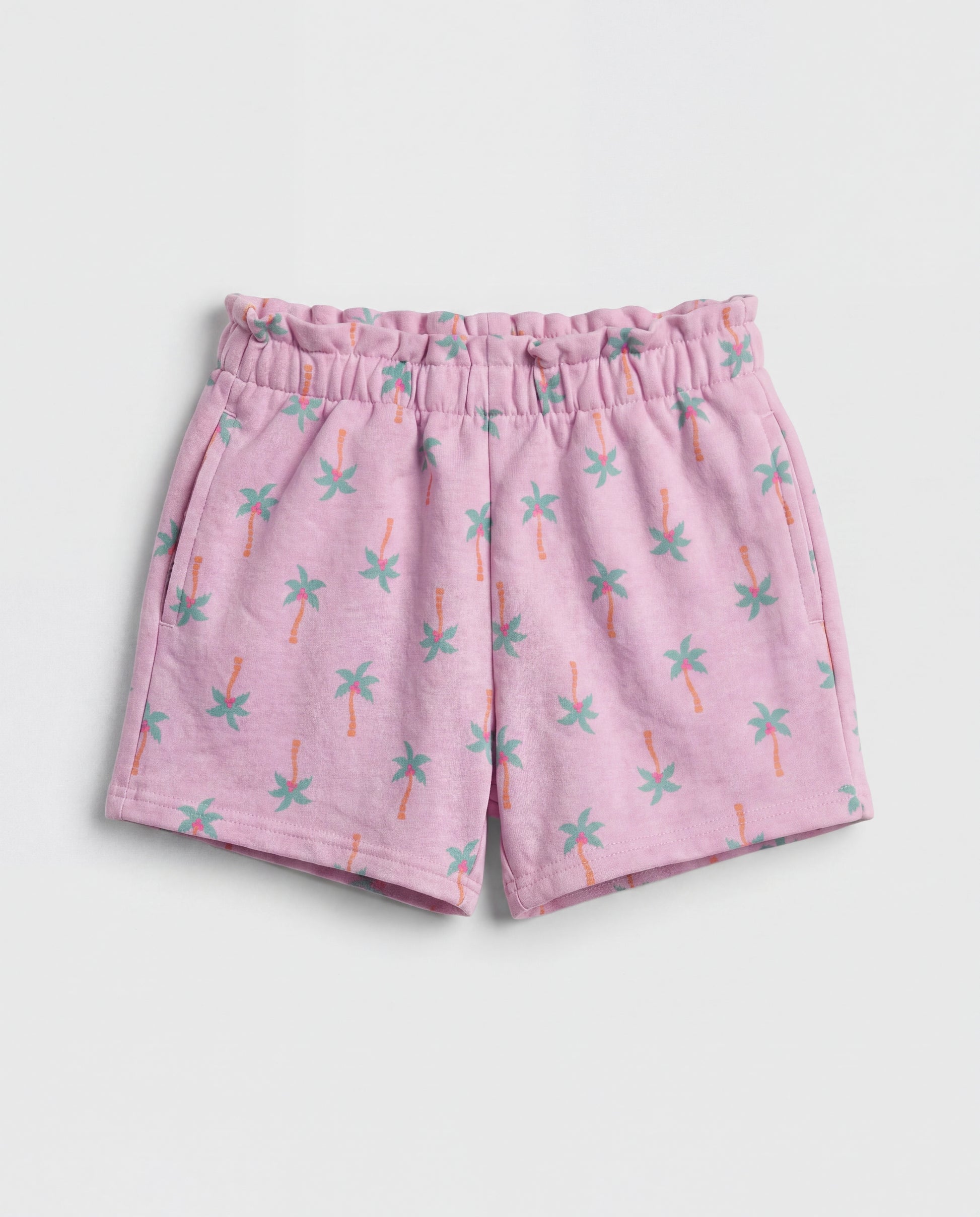 Front flat-lay view of girl's lilac short pant with all-over teal and orange mini palm tree print and ruched paperbag elasticated waistband