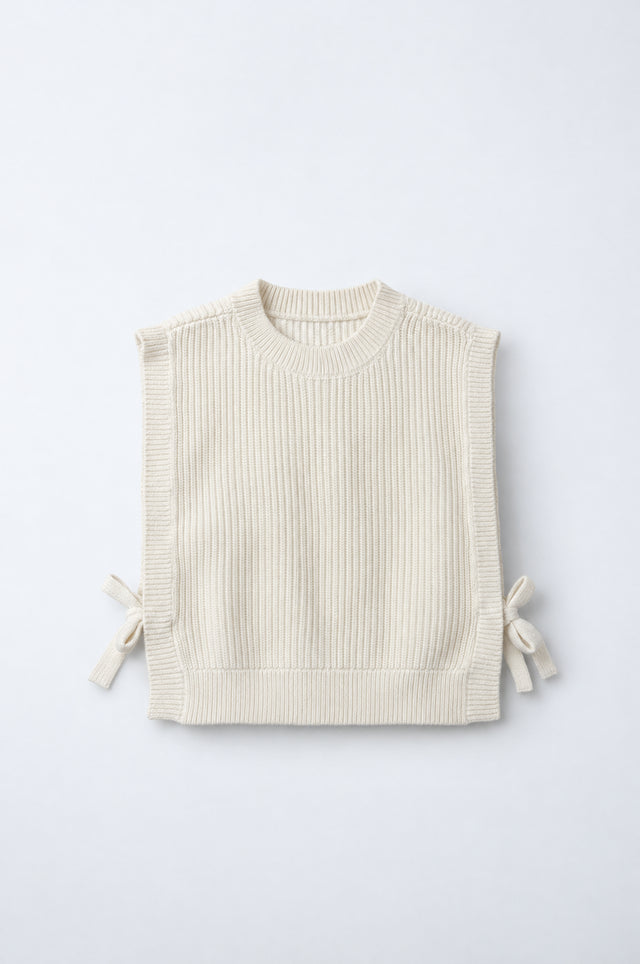 PTex Fashion kids’ ecru rib-knit sleeveless sweater vest with crew neck and side bow ties, front flat lay