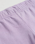 Close-up of girls' baby purple cotton leggings showing ruched elasticated waistband detail and soft breathable fabric texture.