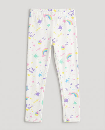 
Full-length white girls' slim-fit leggings with all-over pastel magic-themed print including rainbows, stars, hearts, crowns, cupcakes and paint splashes, laid flat on a white background.