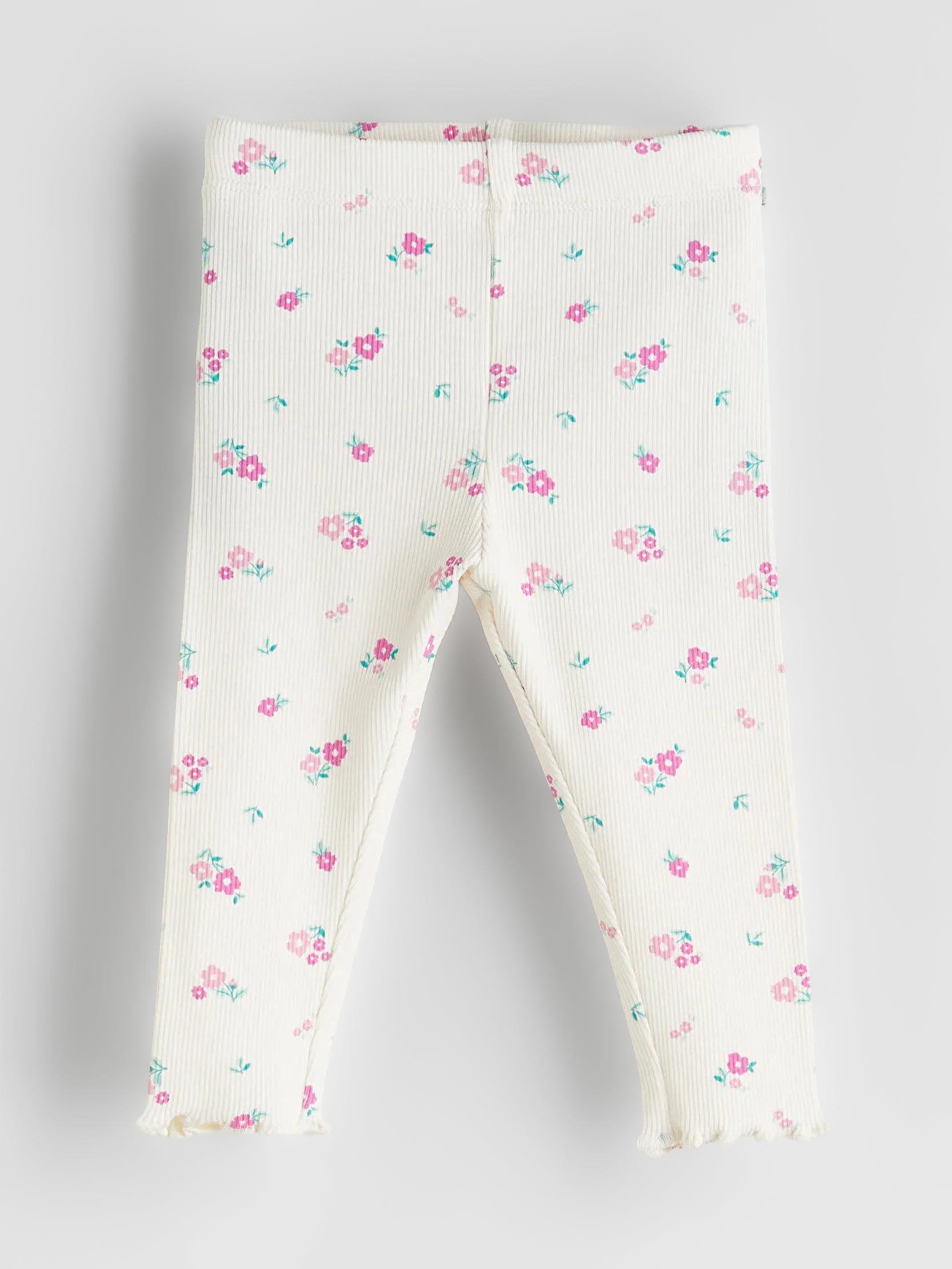 Floral-patterned baby leggings on a light gray background