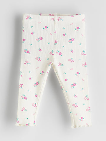 Floral-patterned baby leggings on a light gray background