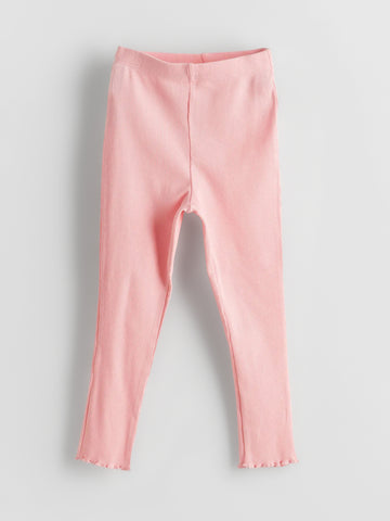 Girl's Soft Pink Ribbed Leggings on a gray background 