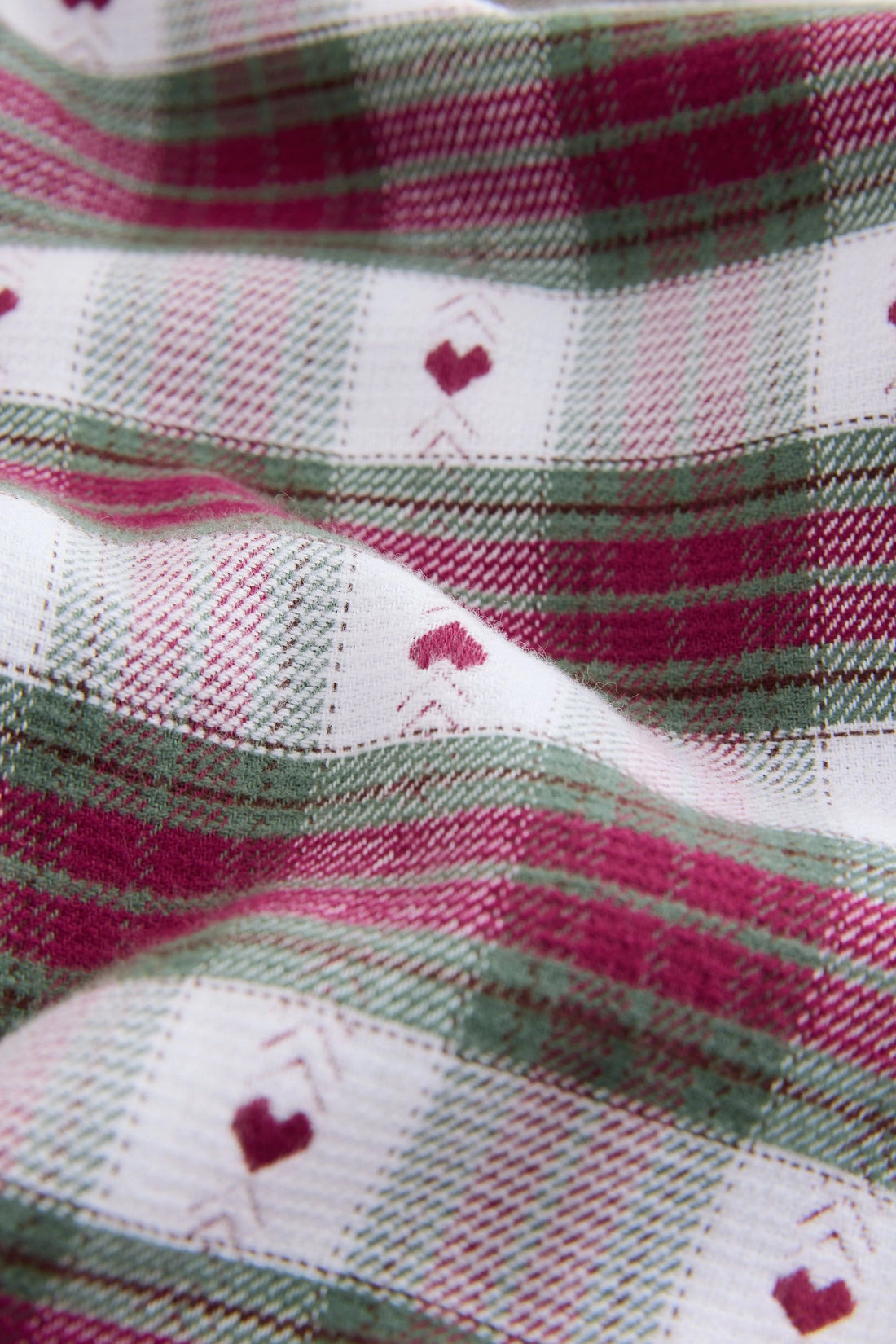 Girls' berry and sage check woven cotton trousers with heart motif, ribbon bow waist and piped hem, flat lay — PTex Fashion